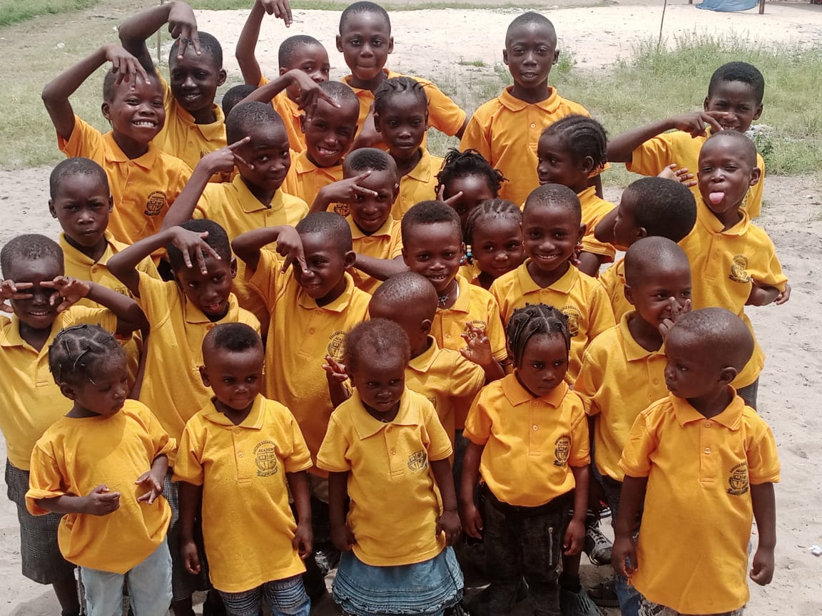 Large group of students in yellow school uniforms